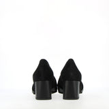 Black suede loafer with gold buckle