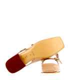 Low nude patent slingback with straps