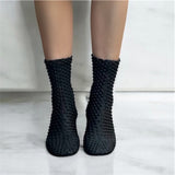Stivaletto morbido nero elasticizzato e ricamato