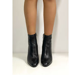 Black shiny leather ankle boot with zip and heel