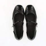 Ballerina bassa morbida in pelle vernice nera con cinturino