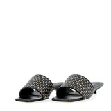 Sandalo mule bassa nera e intreccio metal