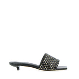 Sandalo mule bassa nera e intreccio metal