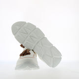 Sneaker in morbida nappa da guanto bianca a mocassino con nappine cuoio