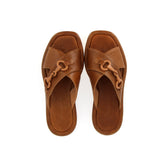 Leather sandal with buckle accessory