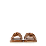 Leather sandal with buckle accessory