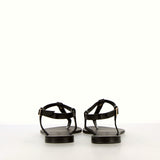 Black flip-flop sandal with strap and gold accessory