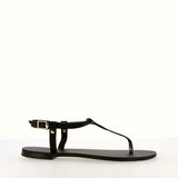 Black flip-flop sandal with strap and gold accessory