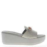 White sandal on light wedge with coconut finish
