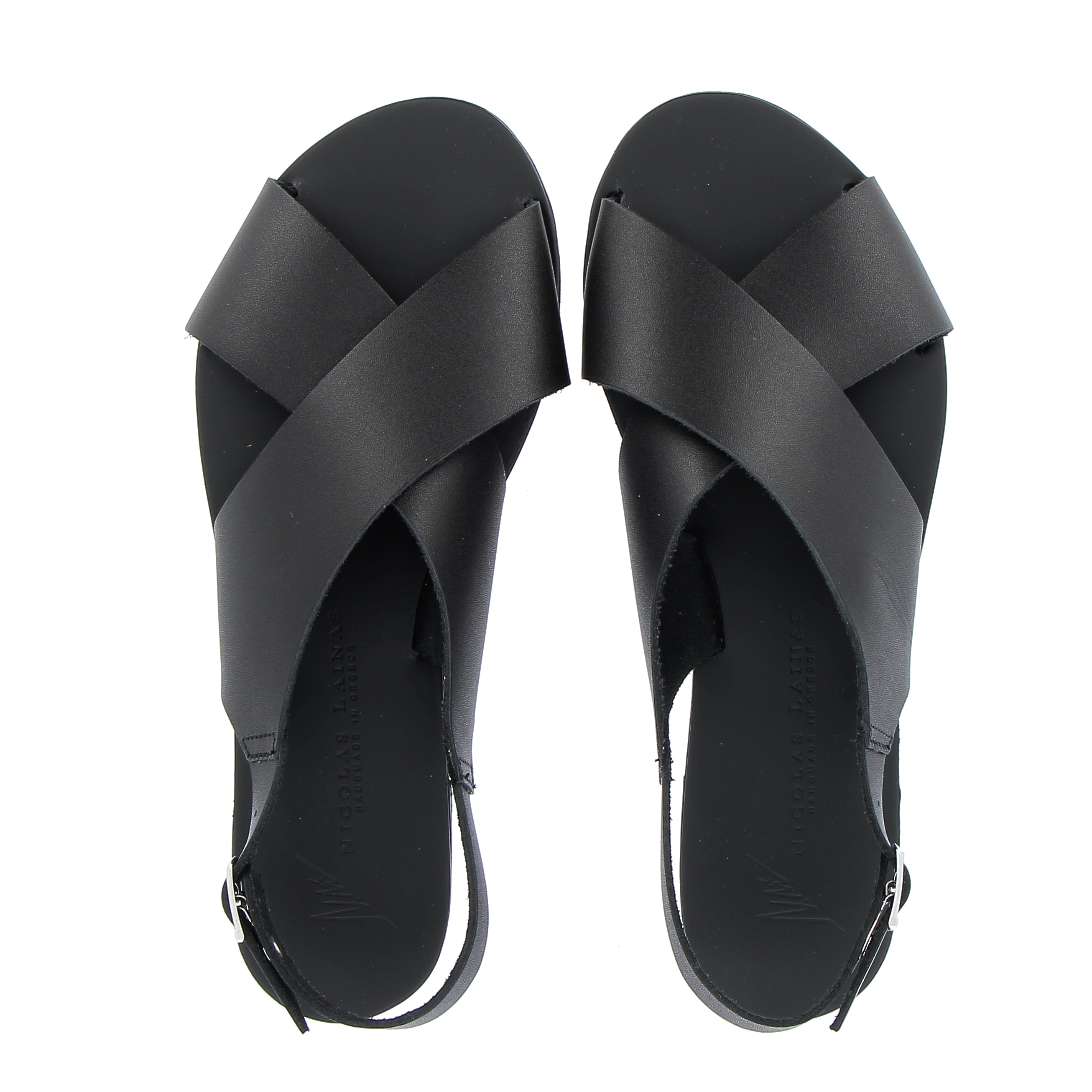 Crossed flat black leather sandal