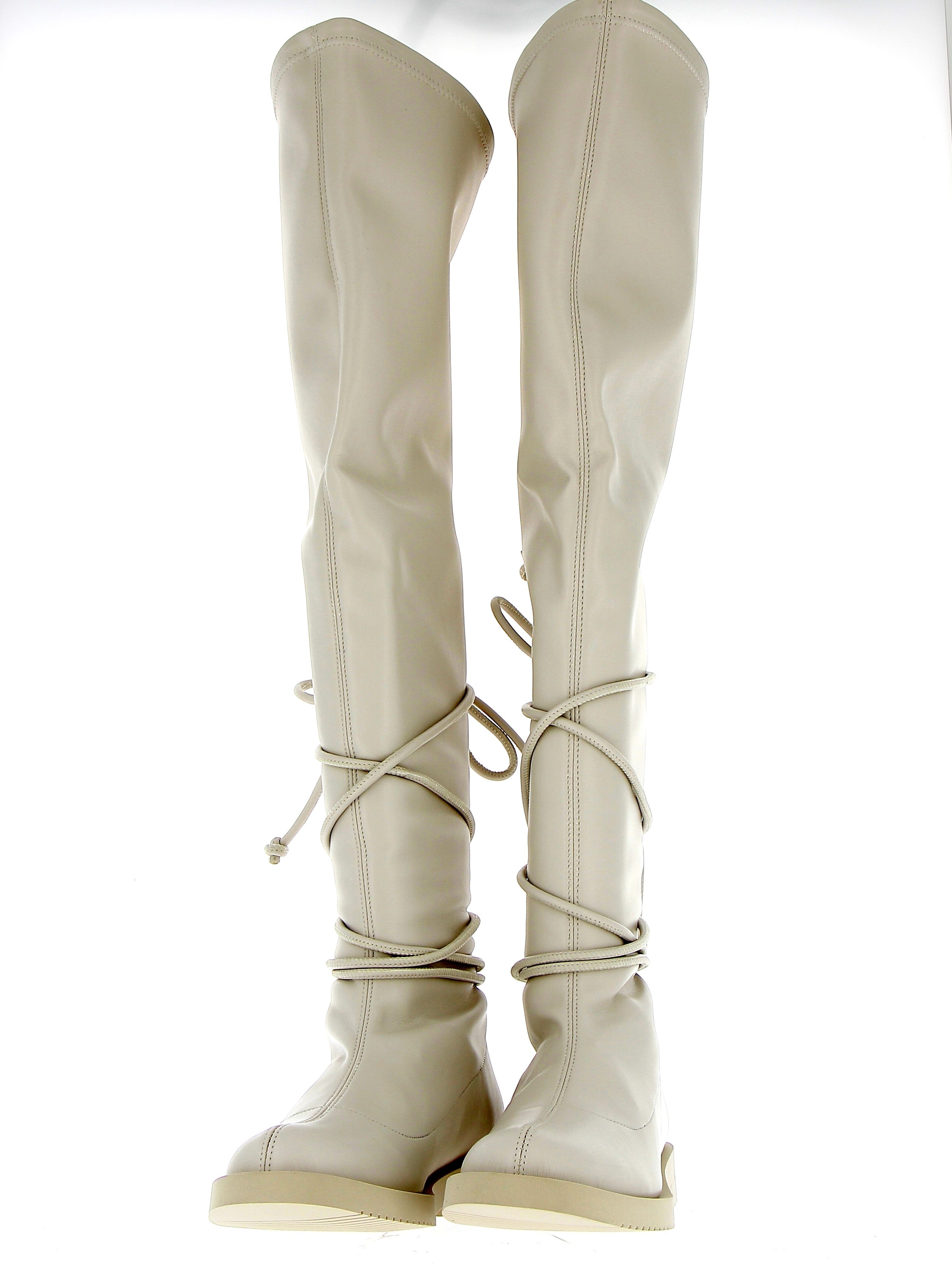 White stretch cuissard boot laced on ankle