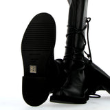 Black stretch cuissard boot laced on ankle