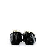 Moccasin in black patent leather with golden buckle
