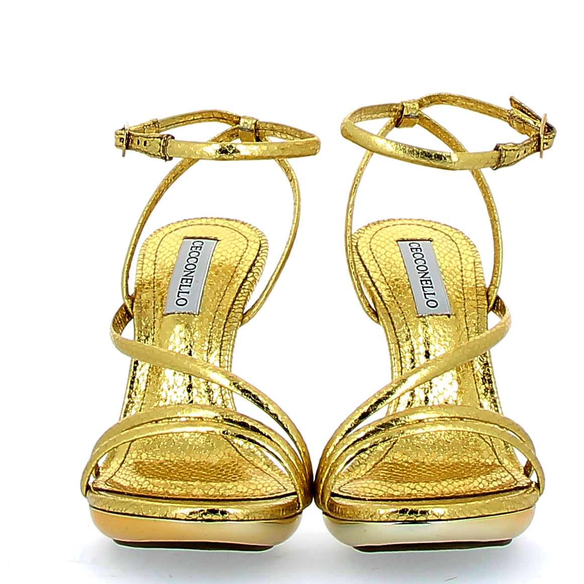 High gold sandal with snake finish on a golden background