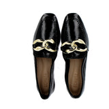 Moccasin in black patent leather with golden buckle