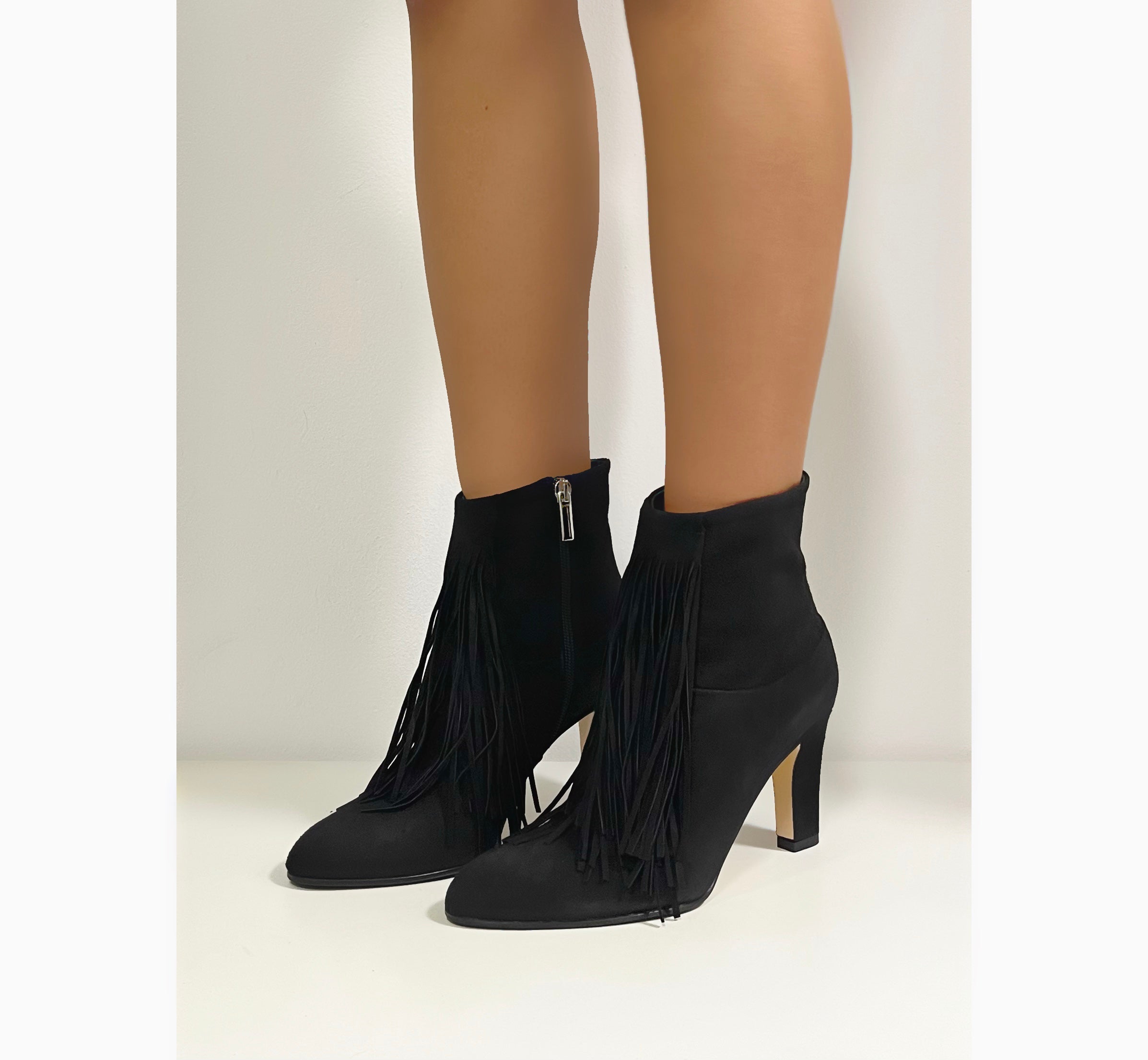 Black suede ankle boot with fringe and internal side zip