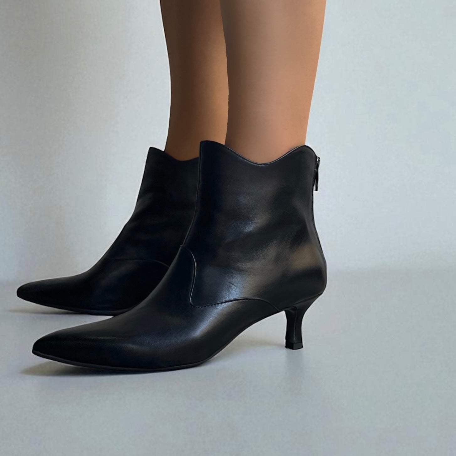 Black leather ankle boot with 55mm heel.