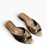 Mule a punta con tacco basso in pelle bronzo