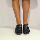 Soft black leather moccasin with medium heel
