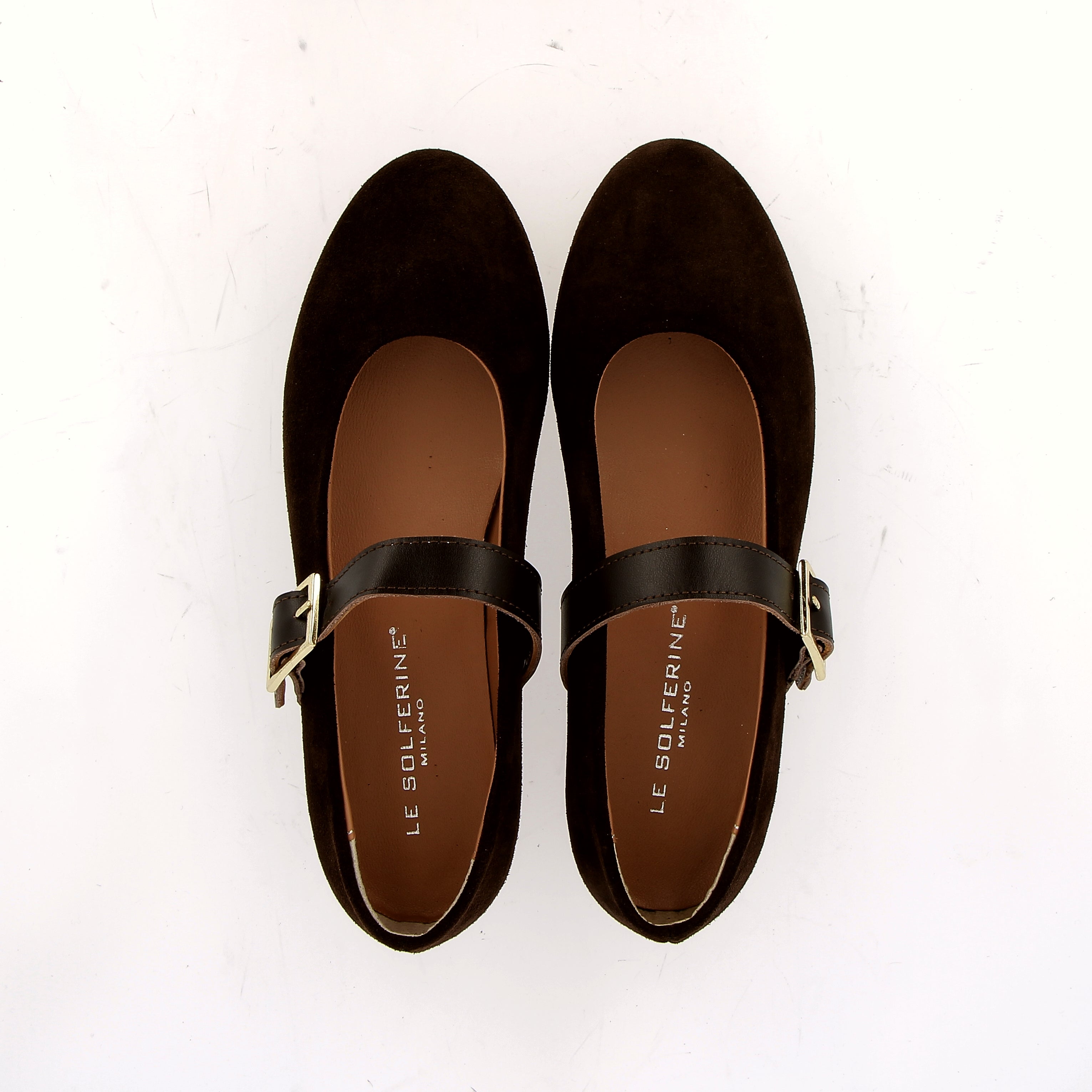 Suede ballerina flats in black with a strap.