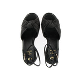 Sandalo nero in raffia con plateau