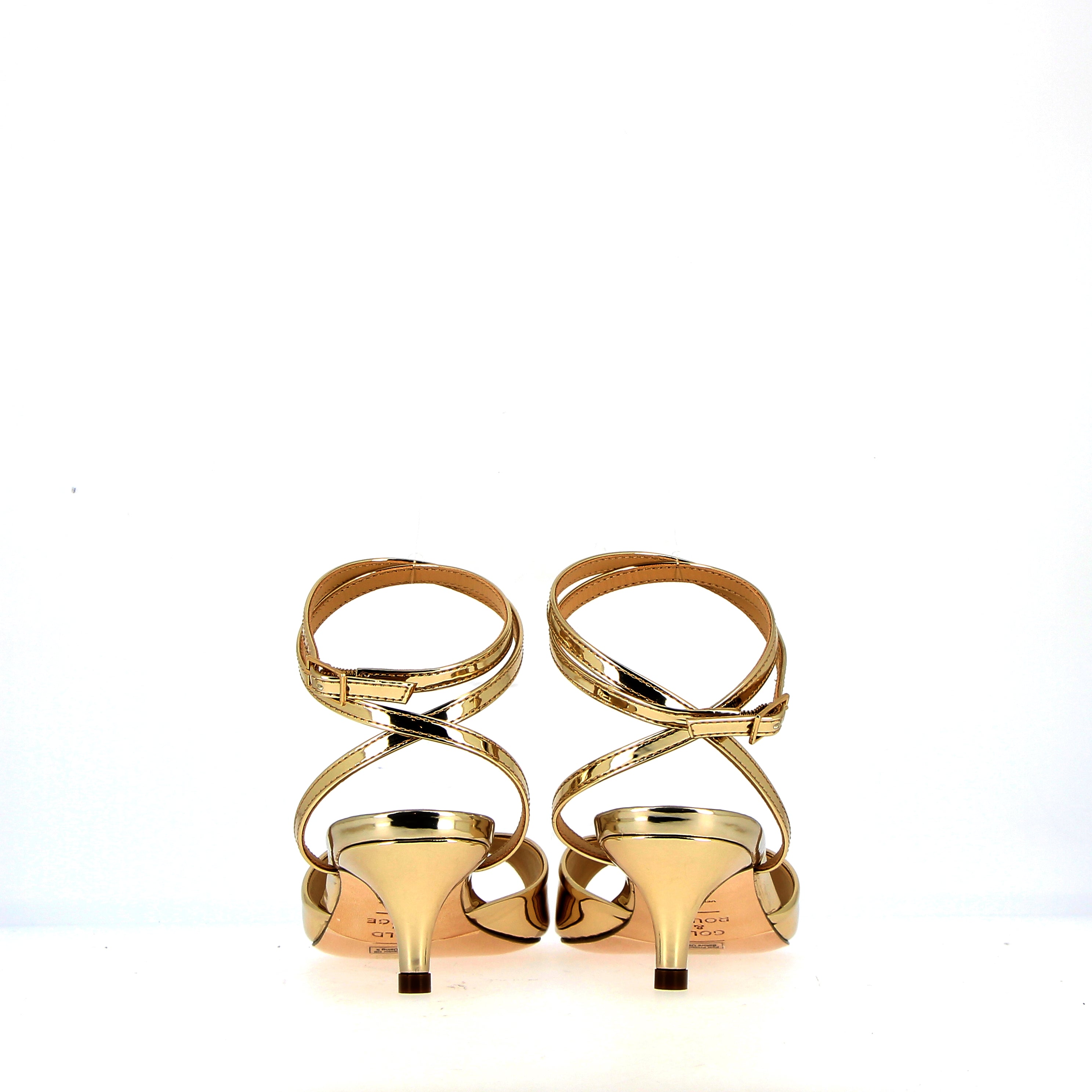 Low heel sandal in gold metal leather with strap