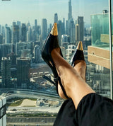 Black slingback with gold tip