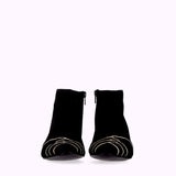 Black suede ankle boot with white motifs