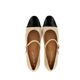 Beige shoe with strap and black tip