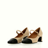 Beige shoe with strap and black tip