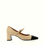 Beige shoe with strap and black tip