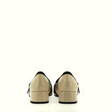 Beige leather moccasin with black profiles