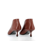 Ankle-length in brick-colored Verlux fabric.
