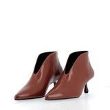 Ankle-length in brick-colored Verlux fabric.