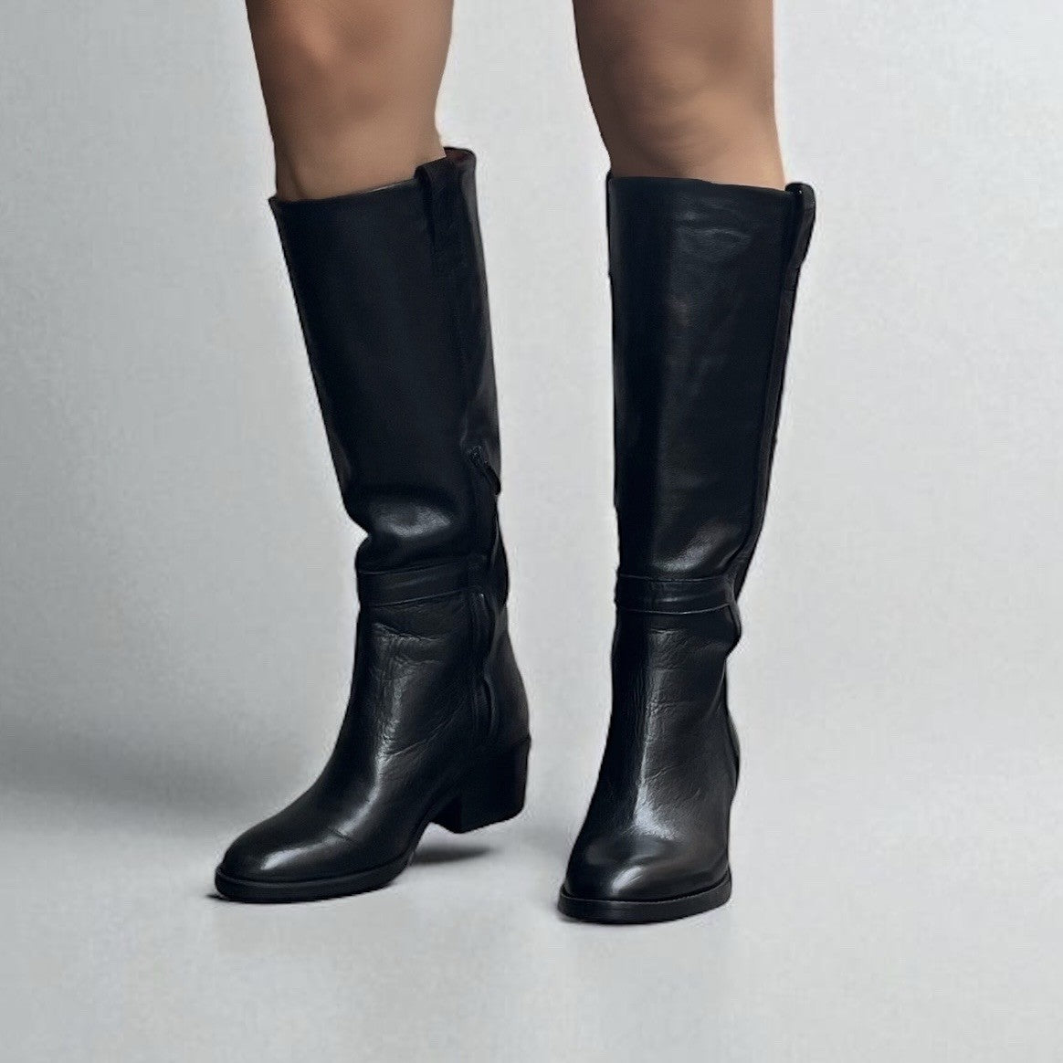 Black leather boot with a medium heel.