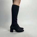 Black, form-fitting boot
