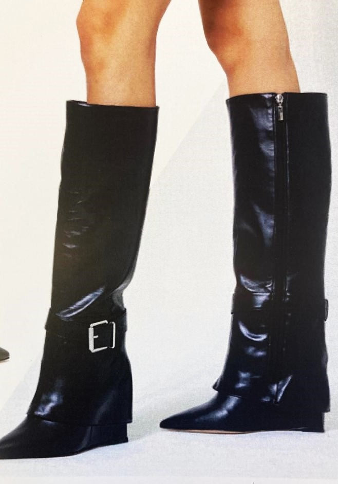 Pointed black leather boot with oversized upper
