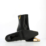 Ankle boot in black nappa with gold metal tip