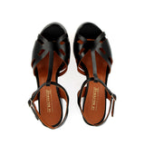 Black sandal in raw cut leather with platform