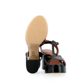 Black sandal in raw cut leather with platform