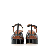 Black sandal in raw cut leather with platform
