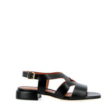 Low black sandal in raw cut leather