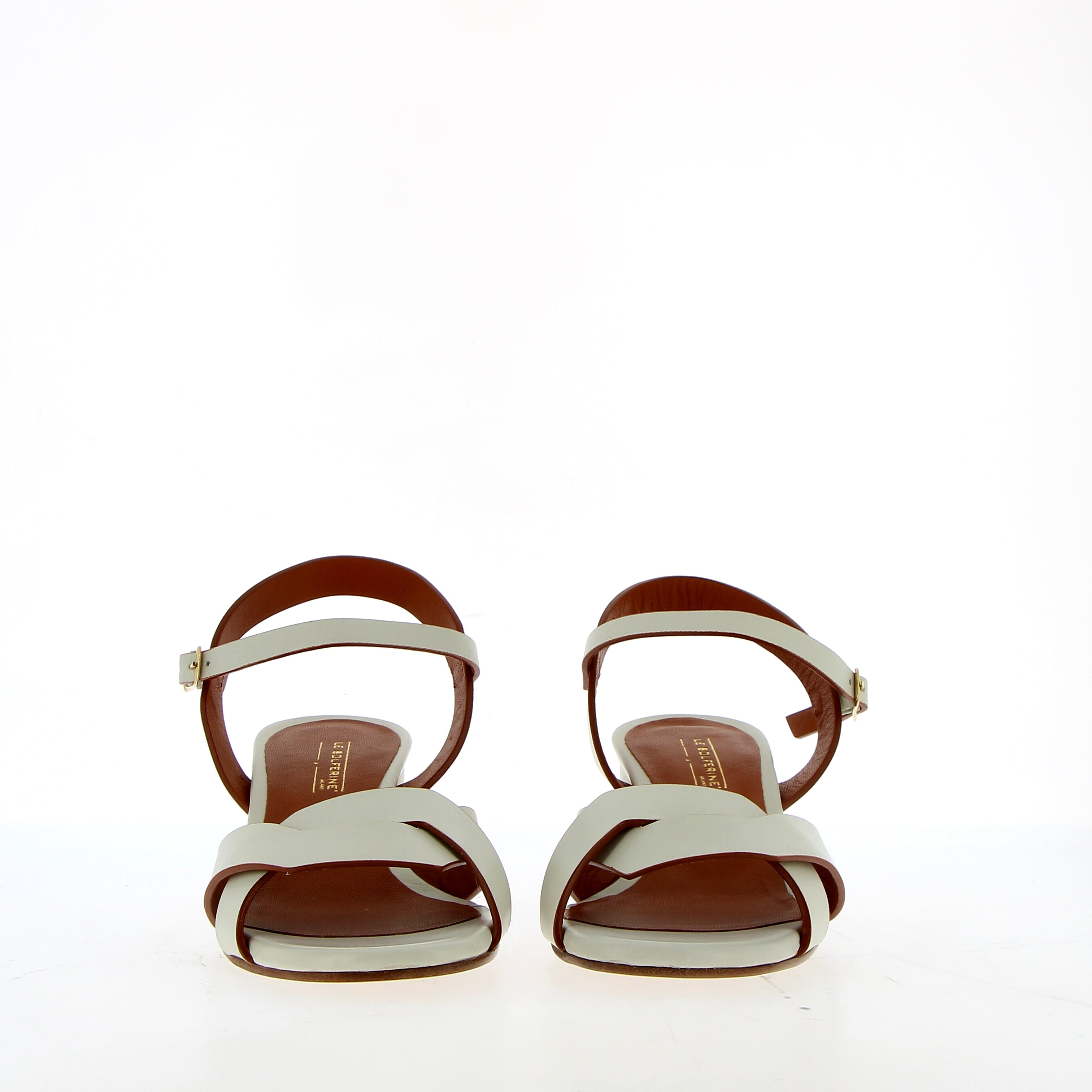 Medium heel sandal in white leather with raw cut