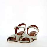 Medium heel sandal in white leather with raw cut