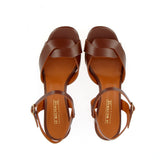 Brown leather medium heel sandal with raw cut