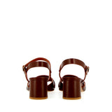 Brown leather medium heel sandal with raw cut