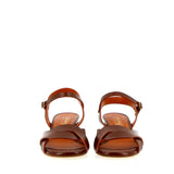 Brown leather medium heel sandal with raw cut
