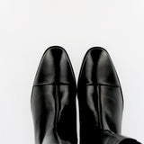 Black leather boot with toe cap and zip