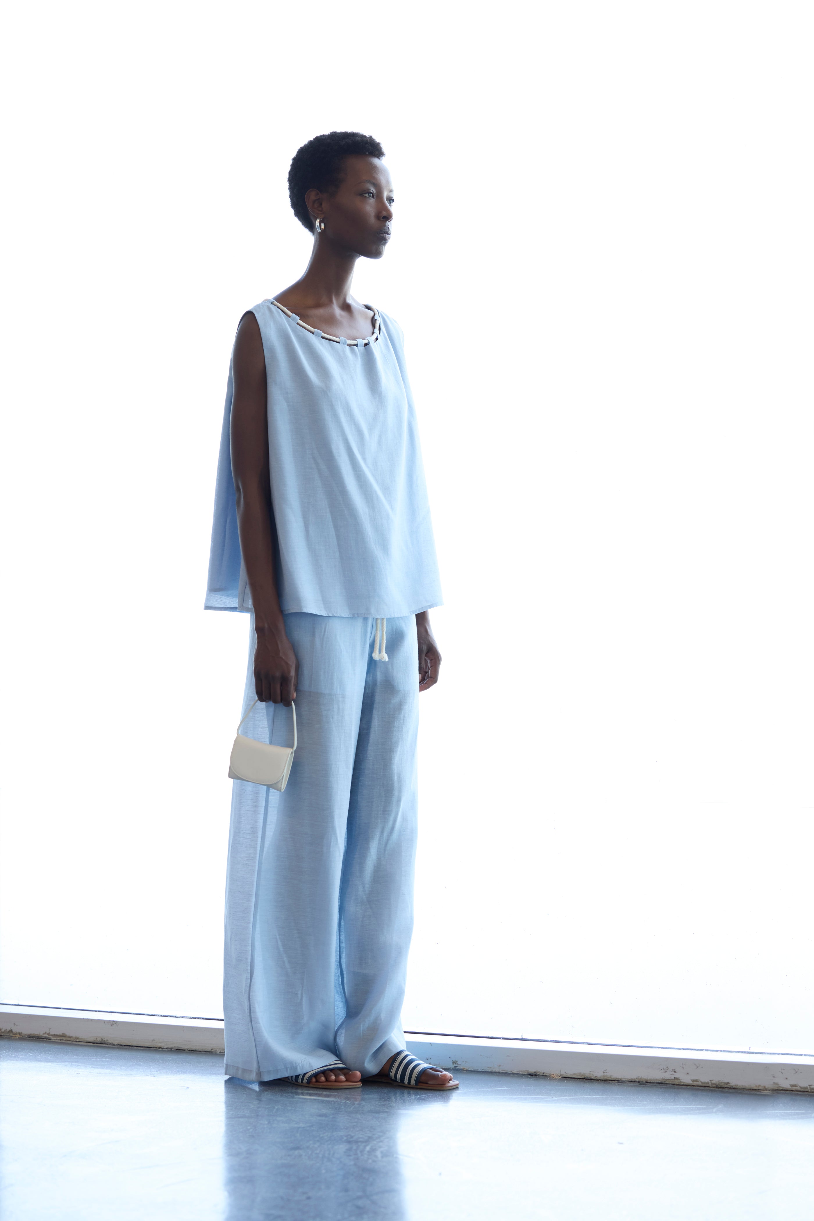 Top celeste con corda