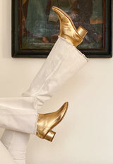 Vintage effect gold ankle boot with rounded heel